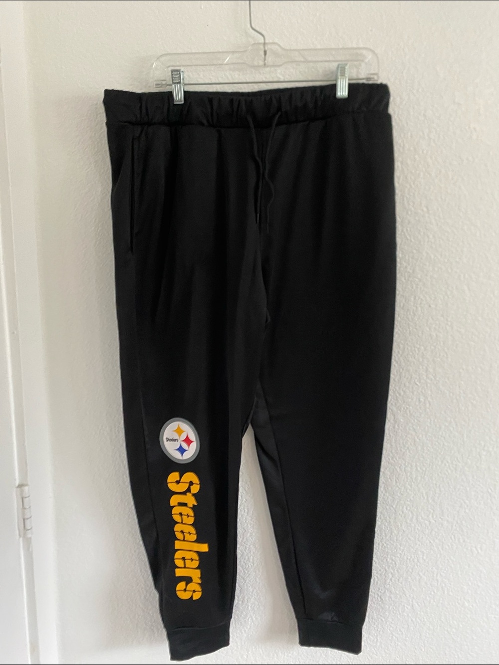 NFL Team Apparel Black Sweatpants with Blue and Red Logo